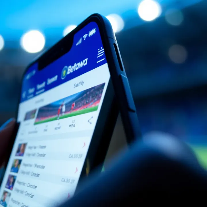 Close-up view of a smartphone displaying BetPawa's sportsbook platform for football betting